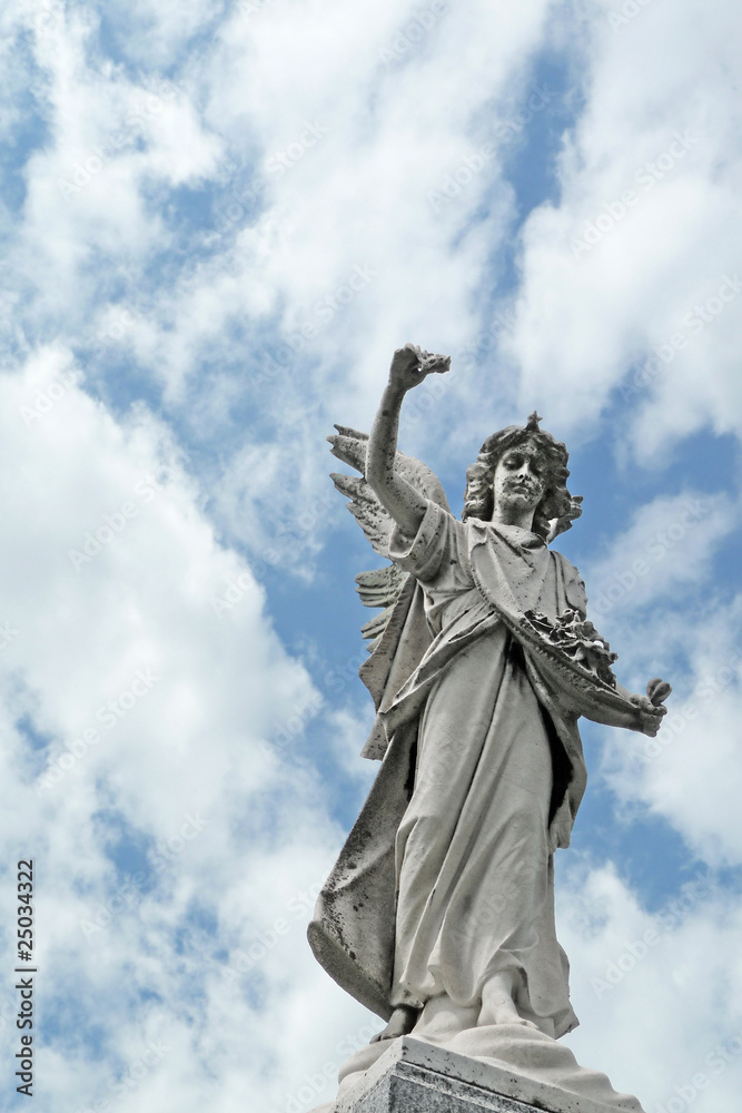 Mournful nineteenth century angel cemetery statue