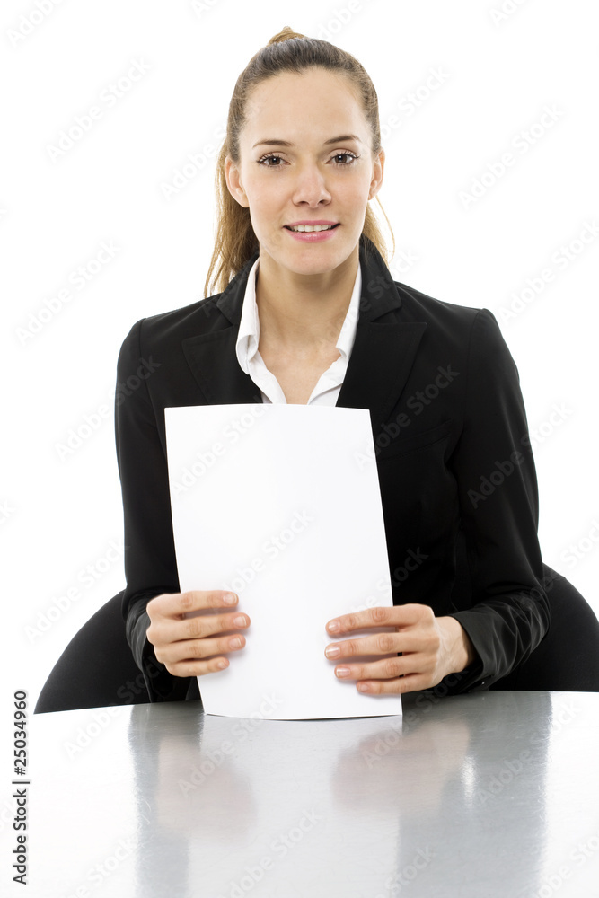 Young businesswoman at a desk with papers in hand Young businesswoman at a desk with papers in hand