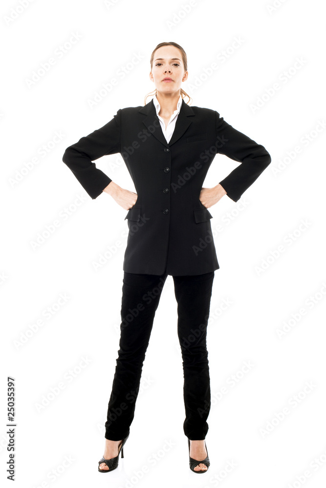 Young businesswoman standing with arms akimbo Young businesswoman standing with arms akimbo