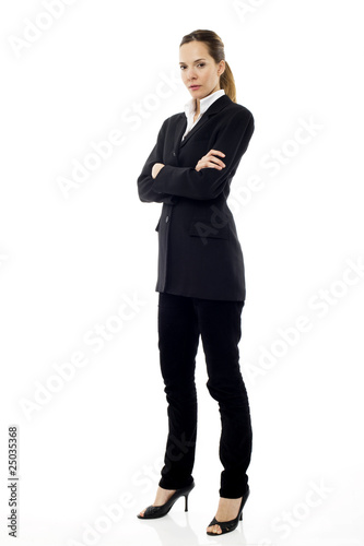 Young businesswoman standing with arms crossed