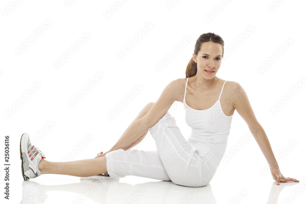 Young woman doing gymnastics on white background studio Young woman doing gymnastics on white background studio