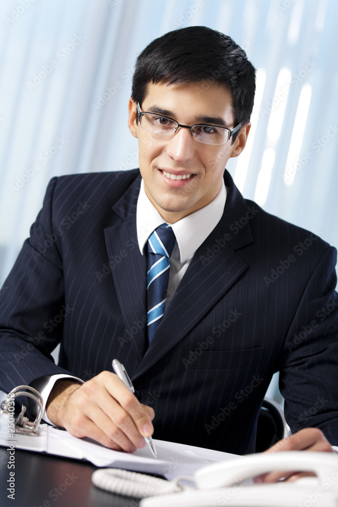 Successful businessman with documents at office Successful businessman with documents at office