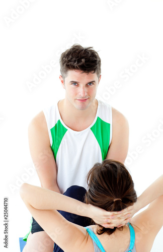 Male therapist doing fitness exercises with a woman