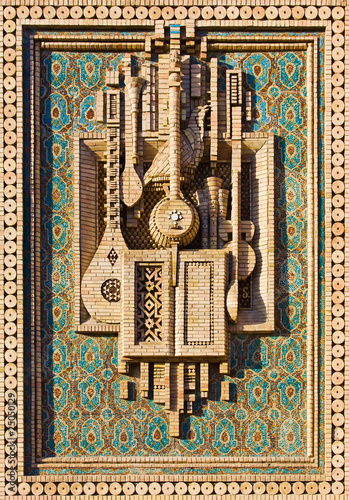 Mosaic of musical instruments made of brick