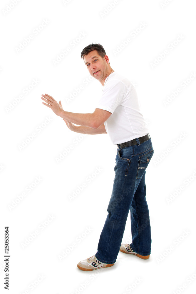 Man is pushing nothing over white background Man is pushing nothing over white background