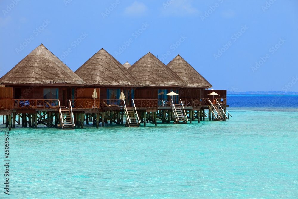 Maldives. .Villa on piles on water .