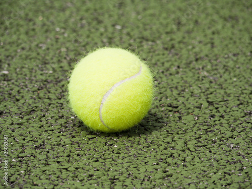 Tennis ball on hard court surface