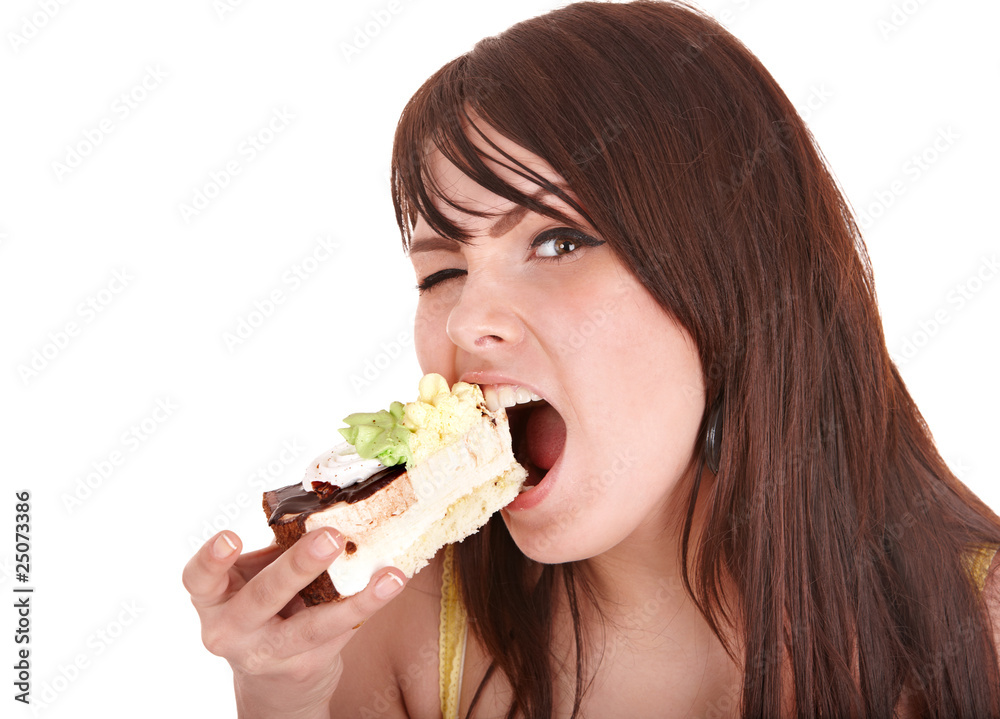 Face of girl eating cake.
