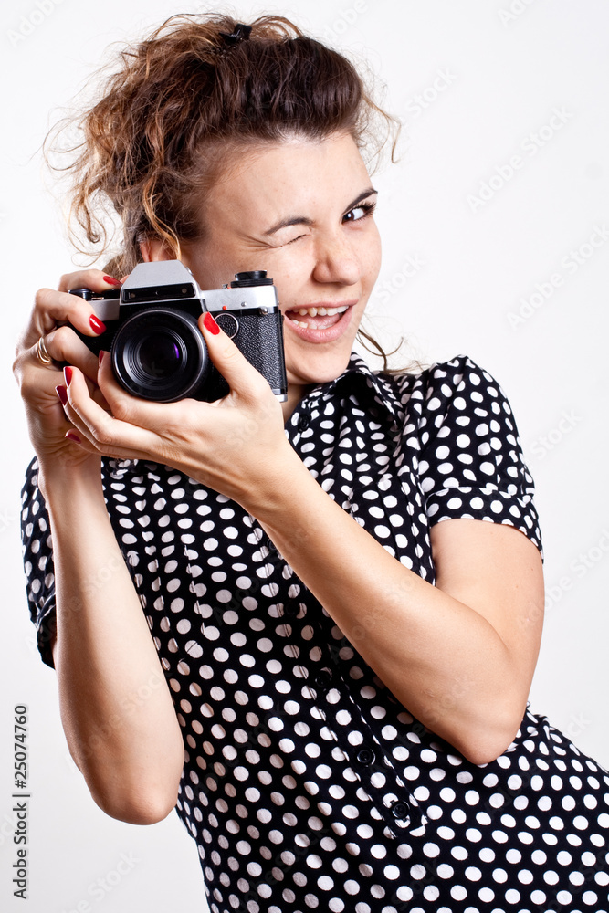 beautiful woman in a black polka dot dress with camera beautiful woman in a black polka dot dress with camera