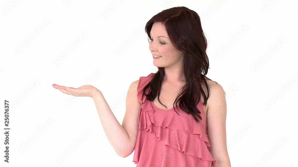 Attractive woman with palm up against a white background Attractive woman with palm up against a white background