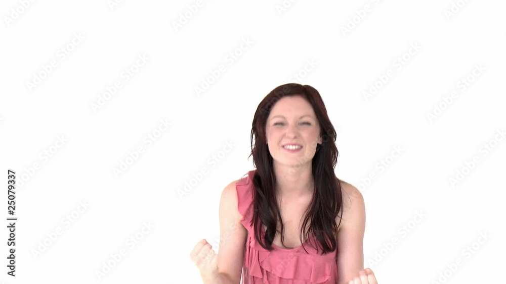 Happy young woman showing satisfaction against a white Happy young woman showing satisfaction against a white