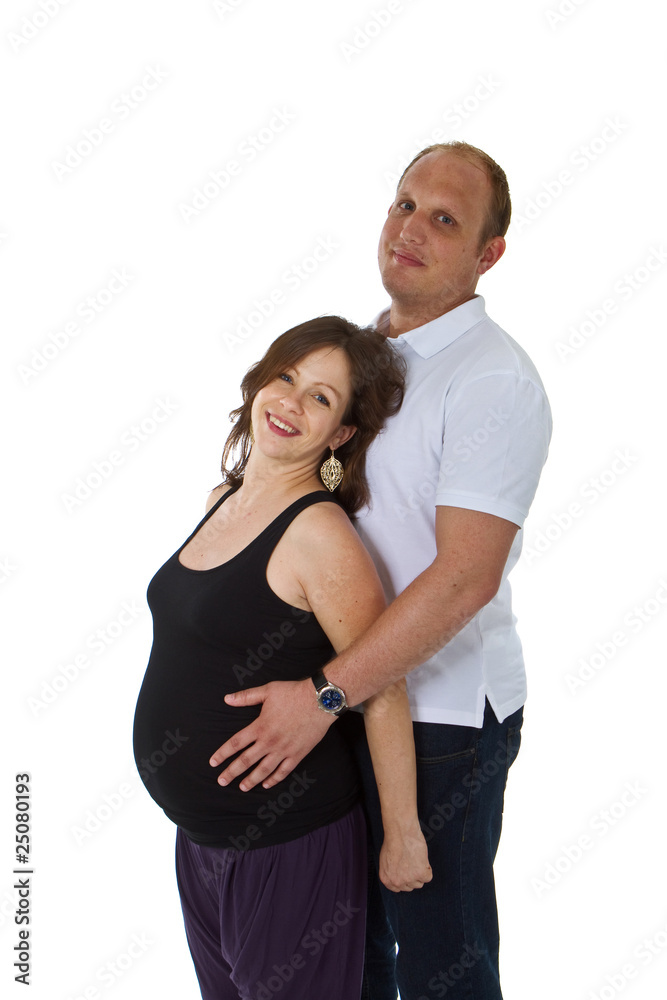 Fototapeta premium Young couple standing in studio setting isolated over white back