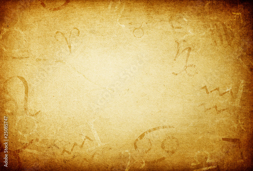Texture of old paper with zodiac signs, abstract astrology theme
