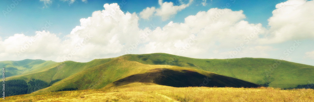 Summer clouds above Carpathian mountain meadows im hdr
