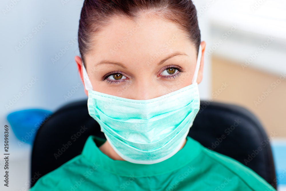 Portrait of a serious surgeon with mask