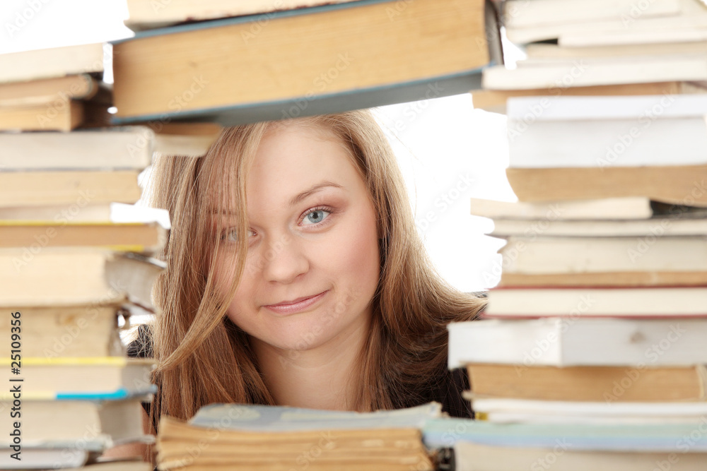Young woman behind books Young woman behind books