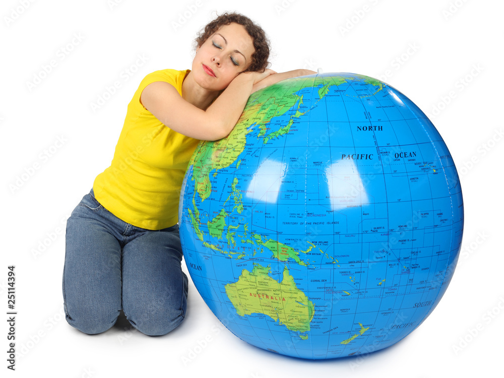 young beauty woman sitting near big inflatable globe young beauty woman sitting near big inflatable globe