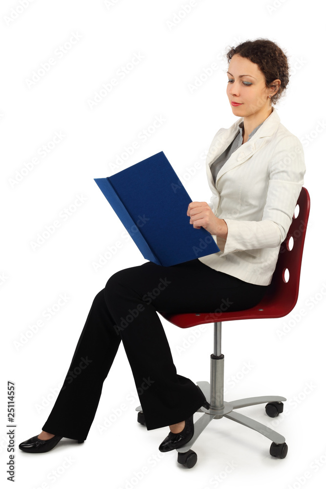 young attractive woman in business dress sitting on chair young attractive woman in business dress sitting on chair