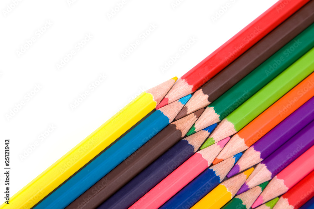 Colored pencils on a white background, studio shot Colored pencils on a white background, studio shot