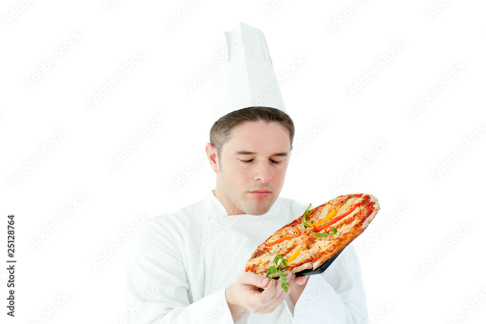 Caucasian male cook holding a pizza Caucasian male cook holding a pizza