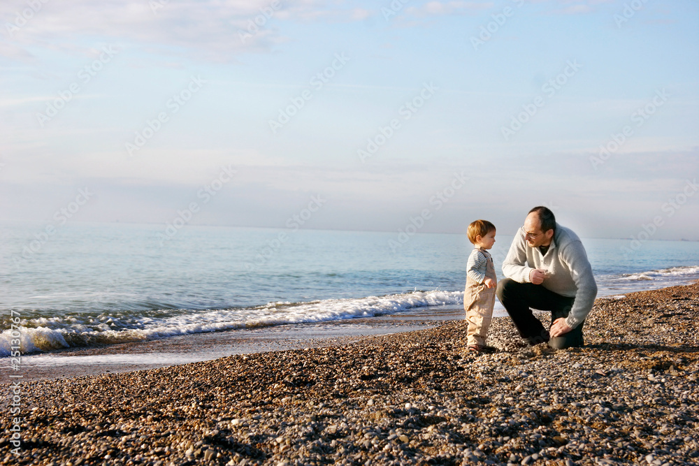 father and son on beach