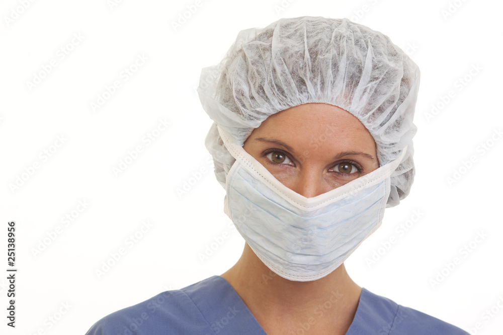 Close up portrait of woman doctor with surgical mask and cap Close up portrait of woman doctor with surgical mask and cap