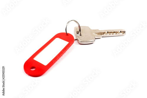 Key and red trinket. © Roman