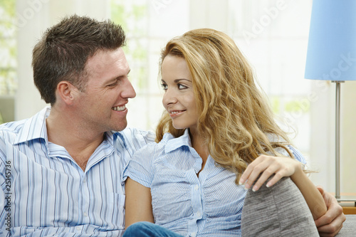 Happy couple on sofa