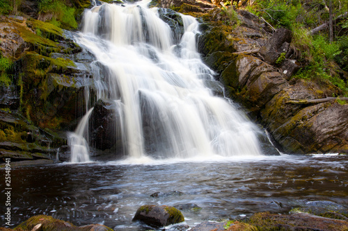 Beautiful landscape with wood and a waterfalls.