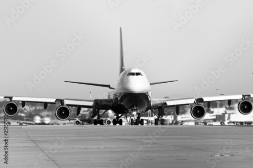 jumbo jet taxiing on runway.
