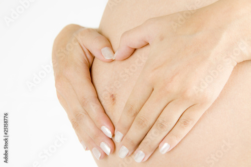 Pregnant mother with hands and heart