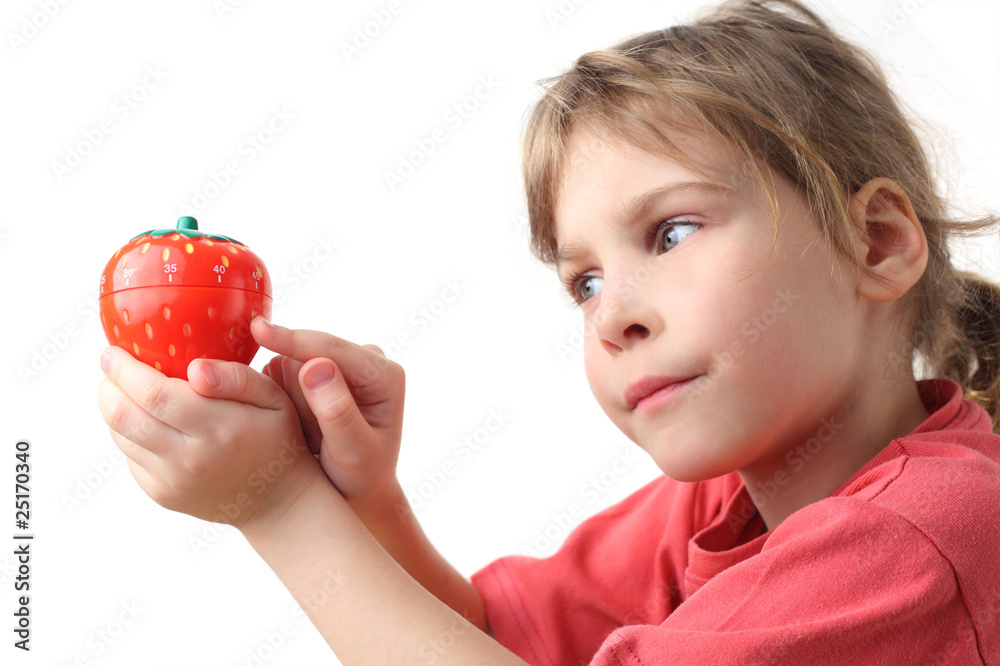 little girl in red shirt holding in hand plastic kitchen timer little girl in red shirt holding in hand plastic kitchen timer
