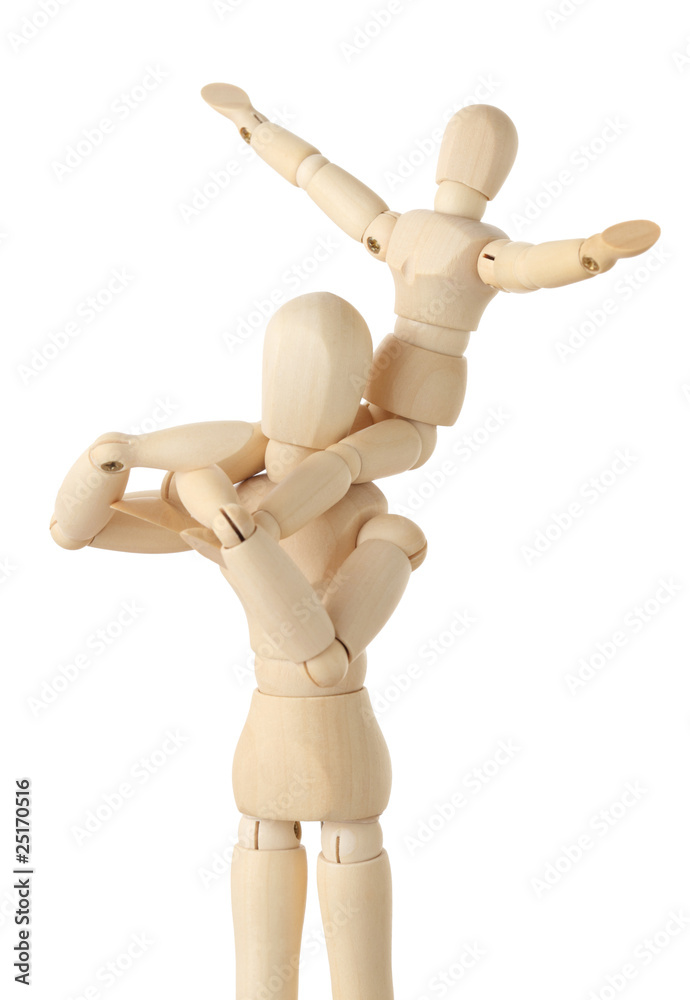 wooden figures of child sitting on neck of his parent wooden figures of child sitting on neck of his parent