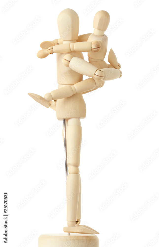 wooden figures of child embracing his parent by shoulders wooden figures of child embracing his parent by shoulders