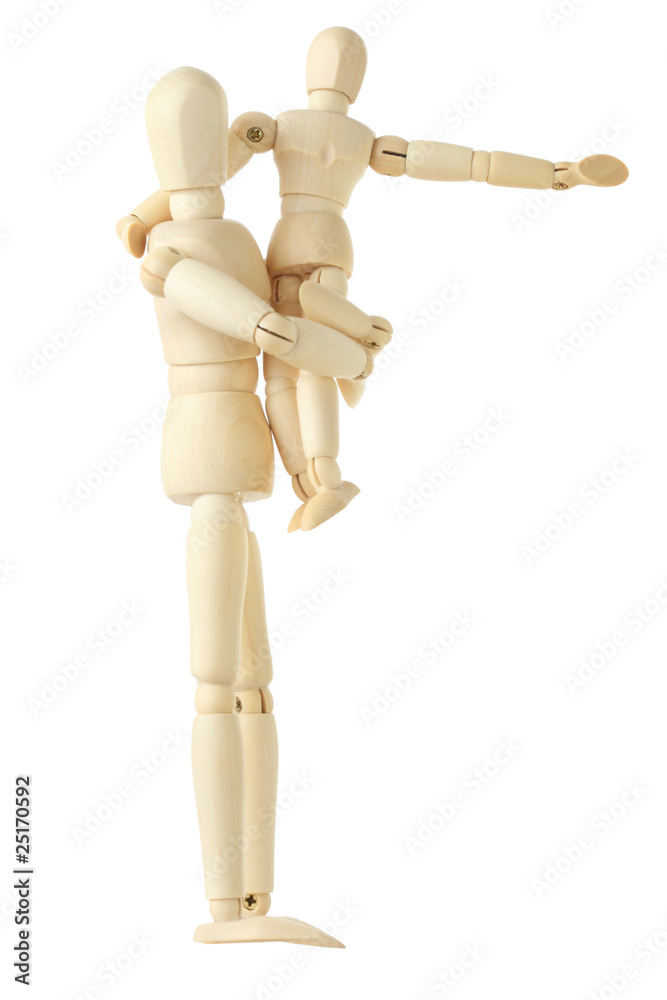 wooden figures of child sitting on hands of his parent wooden figures of child sitting on hands of his parent