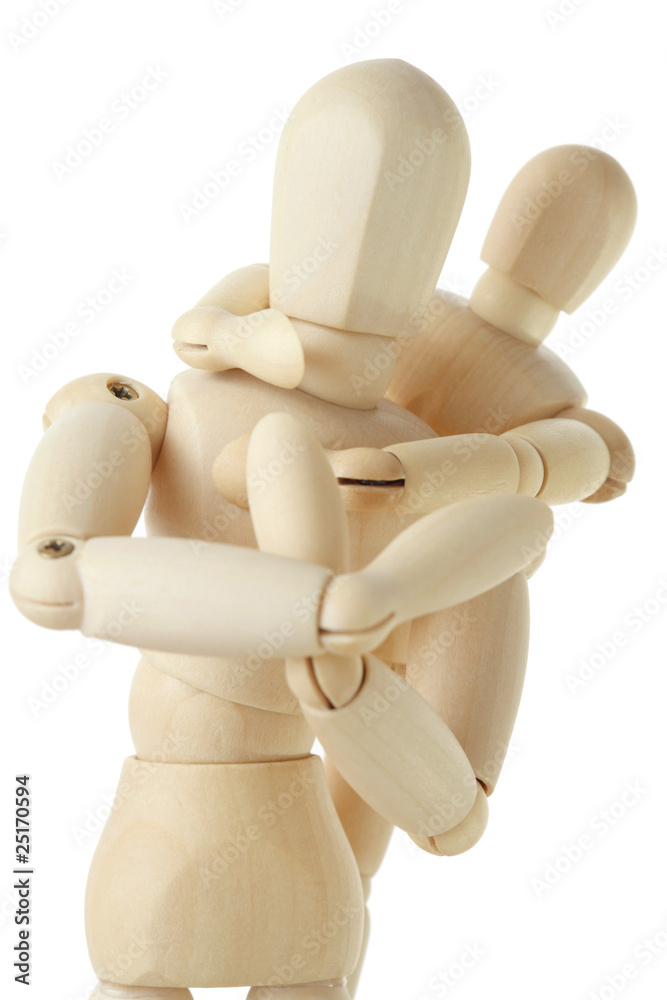 wooden figures of child embracing his parent from back wooden figures of child embracing his parent from back