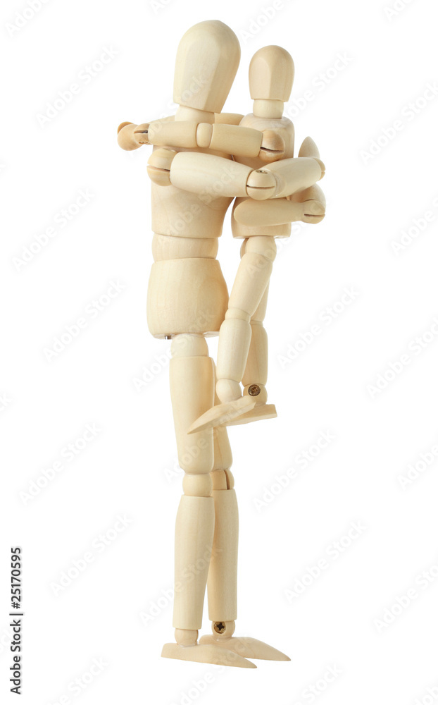 wooden figure of parent holding and embracing his child wooden figure of parent holding and embracing his child