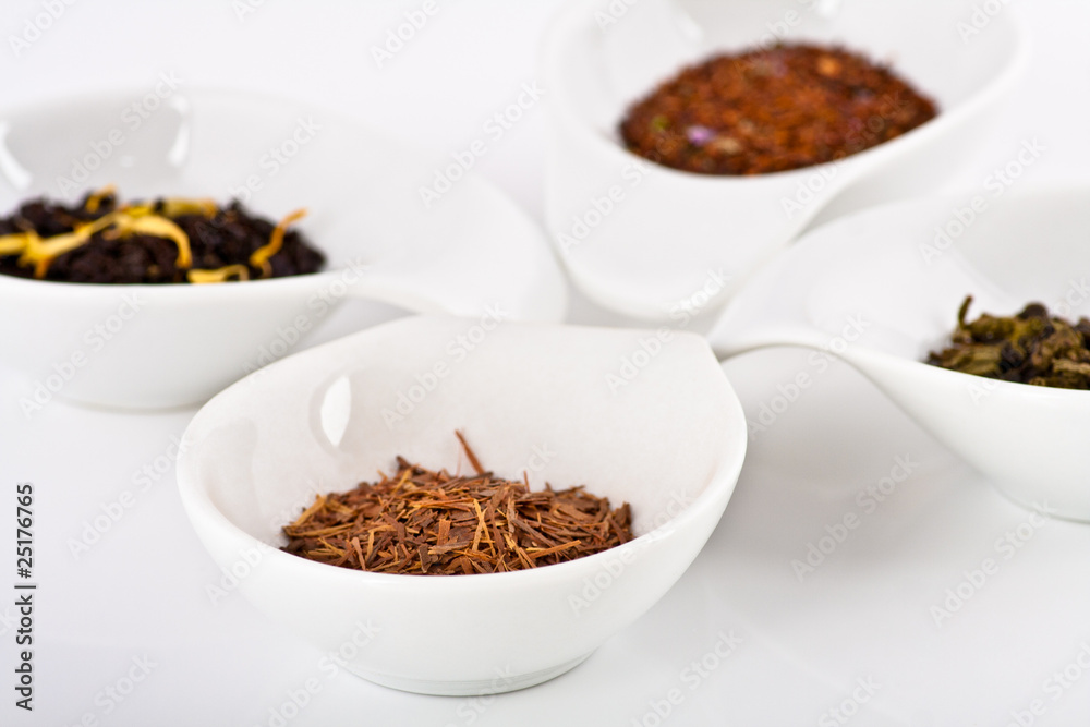 four kinds of tea in small white plates four kinds of tea in small white plates