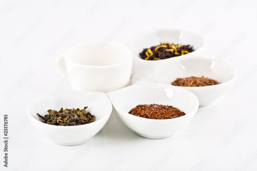 four kinds of tea in small white plates four kinds of tea in small white plates