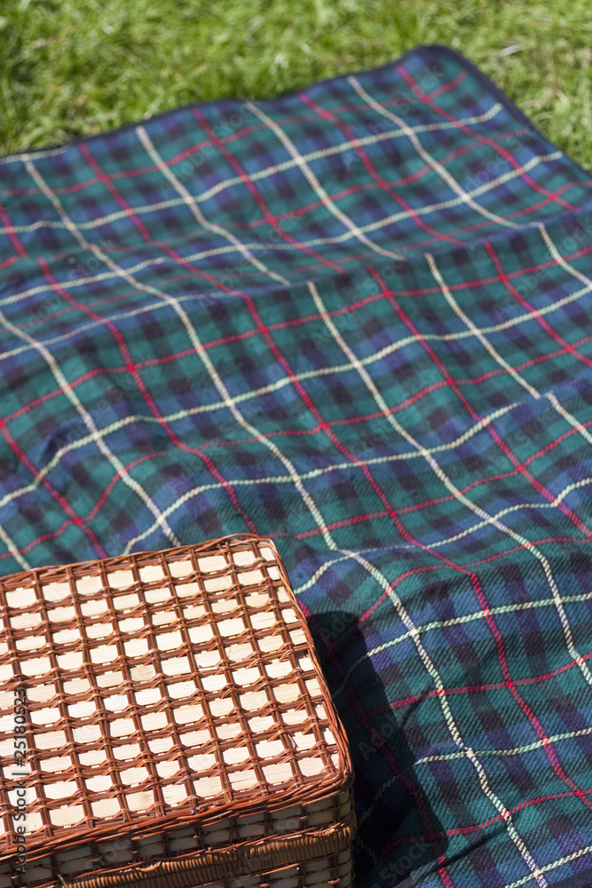 Picnic basket on blanket Picnic basket on blanket