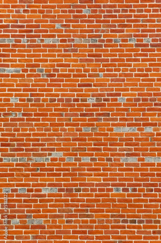 Large section of colorful vintage brick wall exterior background