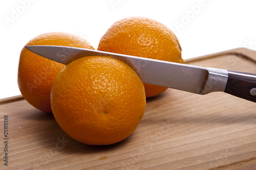 Orange on cutting board