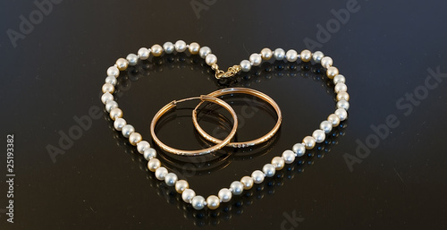 Beads in the shape of a heart with two rings