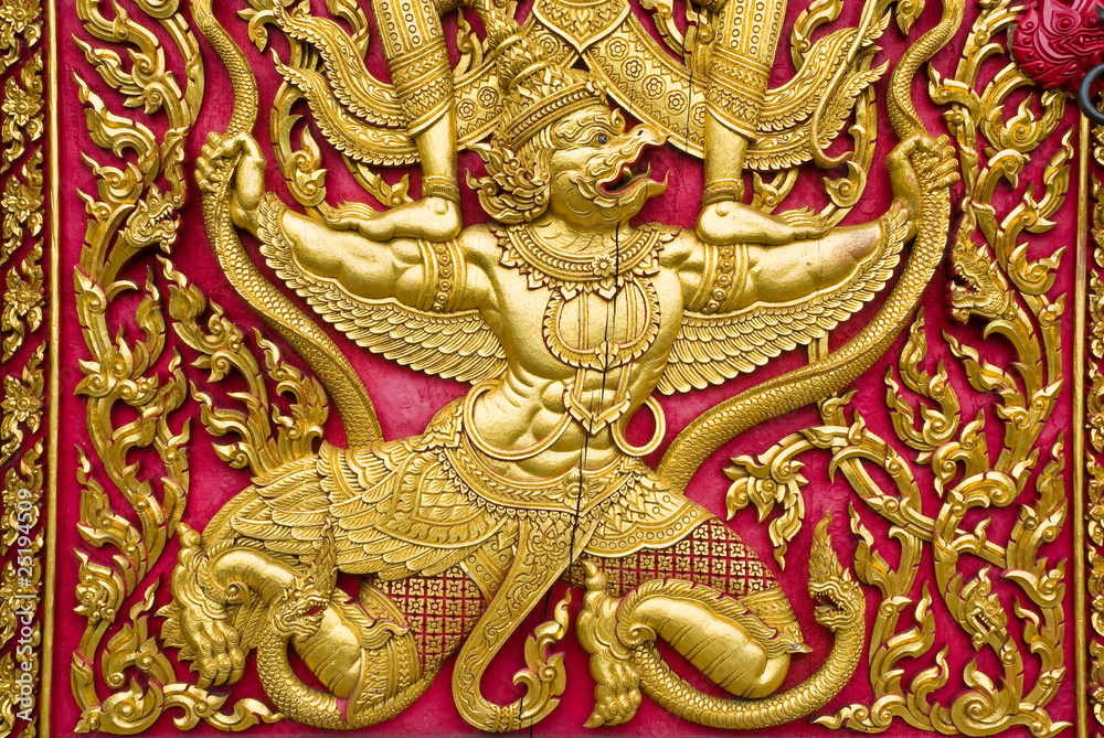 garuda carved gold paint on church door