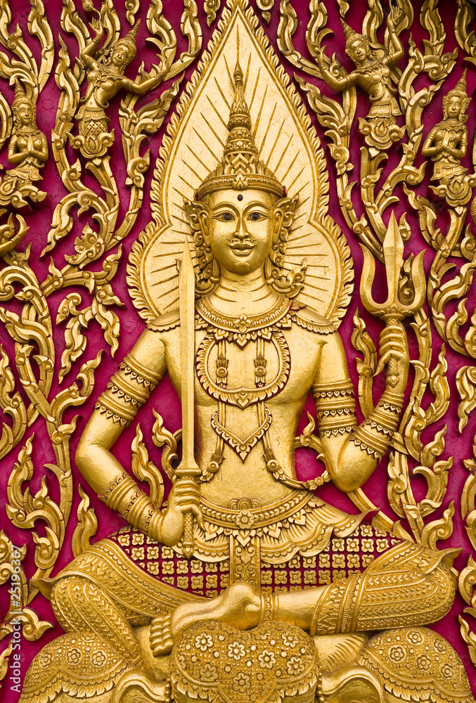Buddha carved gold paint on church door
