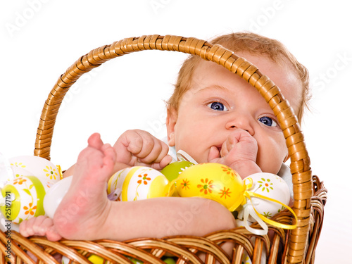Cute 3 months baby boy in the Easter basket
