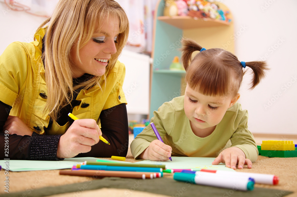 Teacher with child in preschool Teacher with child in preschool