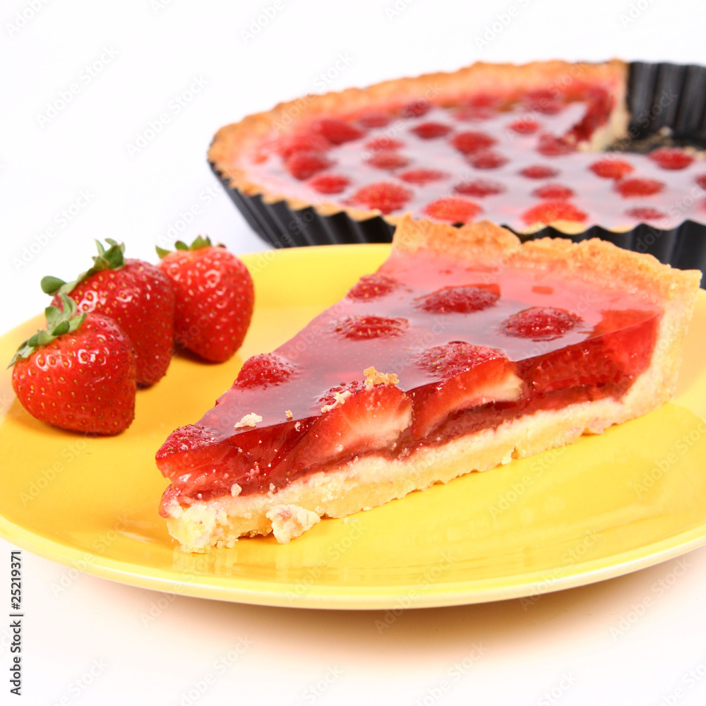 Piece of Strawberry Tart with a tart in a tart pan Piece of Strawberry Tart with a tart in a tart pan