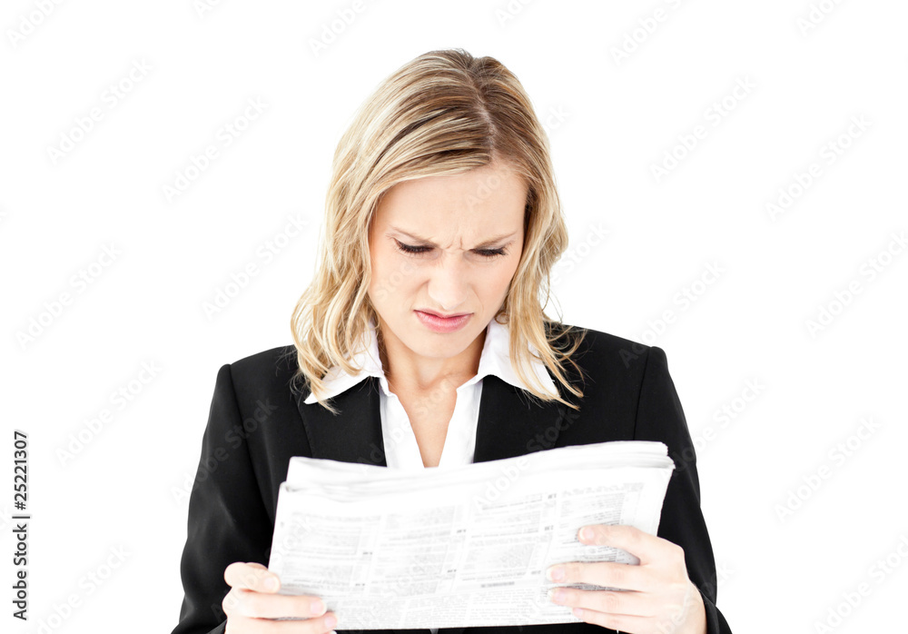 Depressed businesswoman holding a newspaper Depressed businesswoman holding a newspaper