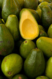 Avocado crop and half delicious ripe avocado cut